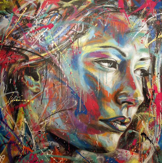 beautiful woman comes to life in colorful spray paint in this 