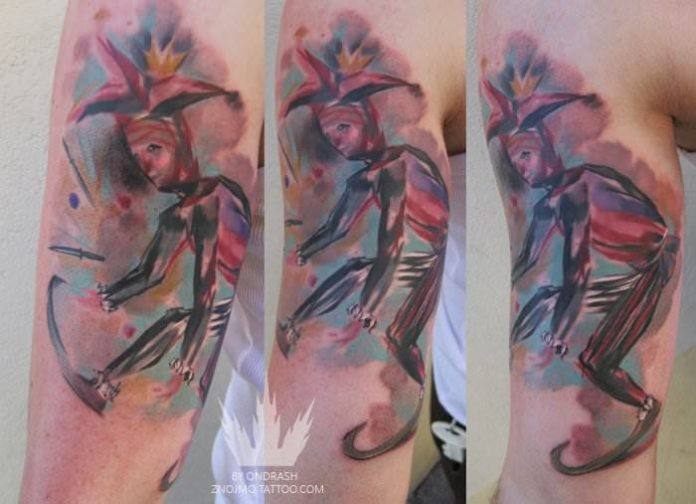 This colorful watercolor tattoo of a jester dancing by Ondrash is a symbol of happiness