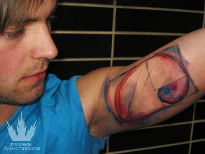 This artistic science tattoo by Ondrash shows a watercolor spiral with geometric proportions