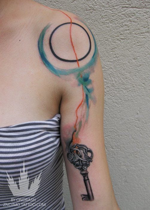 This abstract watercolor tattoo by Ondrash has been personalized to suit its owner