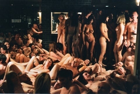 One of Spencer Tunick's mass nude photographs that uses thousands of volunteers to create a naked cocktail party in London