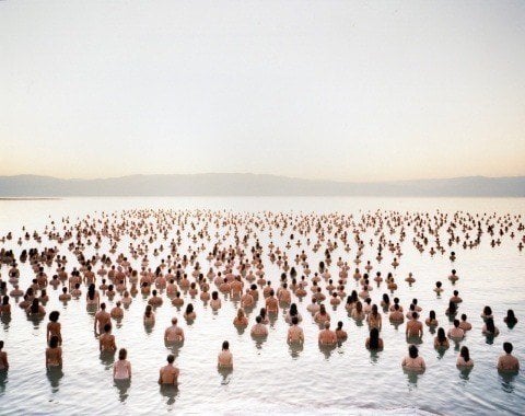 One of Spencer Tunick's mass nude photographs that uses thousands of volunteers to create a powerful photograph in the Dead Sea