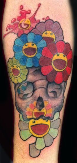 A Luca Natalini surrealist tattoo of a skull and smiling happy daisy flowers