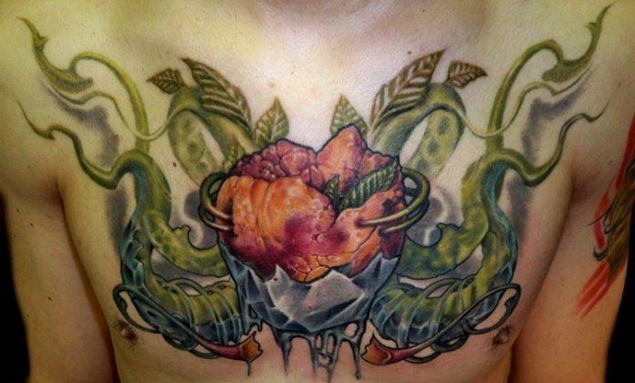 A Luca Natalini surrealist tattoo of a trippy alien flower plant across the chest