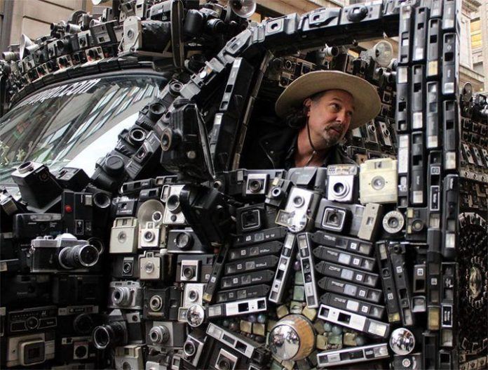 A car covered in cameras by Harrod Blank