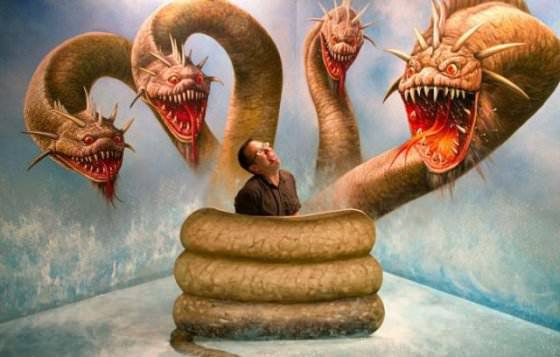 An interactive optical illusion at the Korean Trick Art Museum makes it seem like this guy is trapped in the coils of a hydra dragon
