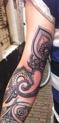 A Barbara Swingaling tattoo inspired by henna and paisley designs