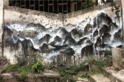 Chinese graffiti artist Hua Tunan turns this overgrown street corner into a mountain view