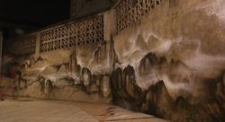 Graffiti artist Hua Tunan creates a subtle abstract landscape on this wall in China