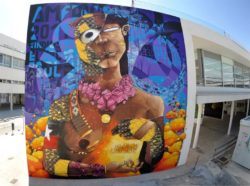 Graffiti artist Inti combines symbols and art styles in this half nude street art painting