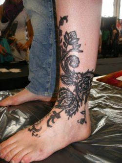 Paisley henna flowers become permanent body art in this Barbara Swingaling tattoo