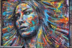 A colorful spray paint portrait of a beautiful girl by London graffiti artist David Walker