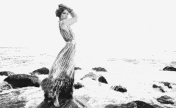A beautiful model is windswept in this black and white animated GIF by Cinemagraphs