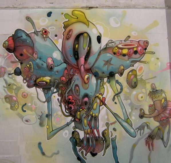 Parasites and other biological elements combine to create a strange character in this graffiti mural by Dhear One
