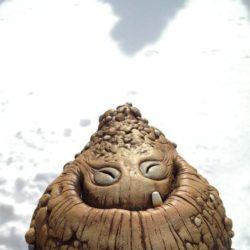 A happy monster doll, created by Chris Ryniak, grins adorably