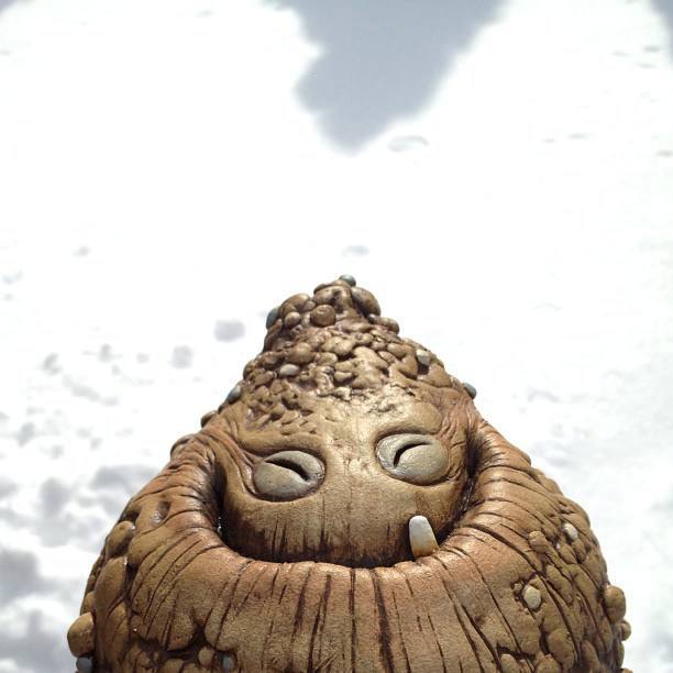 A happy monster doll, created by Chris Ryniak, grins adorably