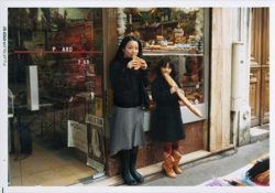 Chino Otsuka poses with her childhood self outside a shop in Paris, France