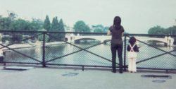 The adult and childhood versions of Chino Otsuka admire the view from a bridge in this Photoshopped picture