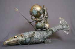 An alien diver with an antique diving helmet rides a fish as if it were a horse in this life like fantasy sculpture by Andrey Drozdov