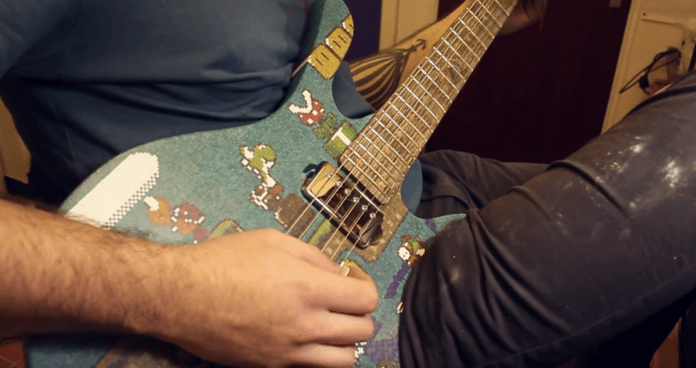 Cranmer plays his finished Super Marios guitar that took seven months and a whole lot of patience and skill to build
