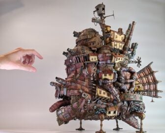 Master minature builder, Youtuber and entertainer Studson reaches out to touch his model of Howl's Moving Castle from the popular anime film